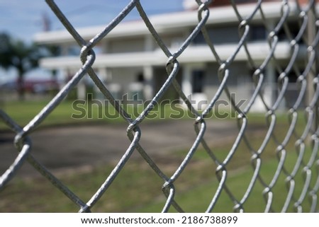 The fence is made of metal wire.