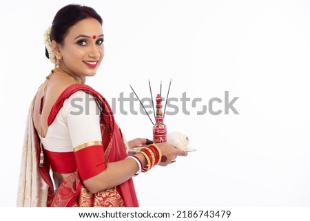 Bengali woman with puja thali. Royalty-Free Stock Photo #2186743479