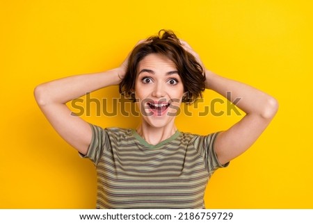 Closeup photo of young adorable lady hold hands head surpised look present open mouth isolated on yellow color background Royalty-Free Stock Photo #2186759729