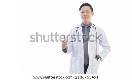 Medicine and healthcare concept : happy and cheerful senior asian doctors standing and posing thump up on white background. COPY SPACE. Royalty-Free Stock Photo #2186765451