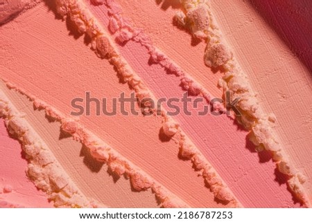 Blusher or pressed powder pink orange peach textured background Royalty-Free Stock Photo #2186787253