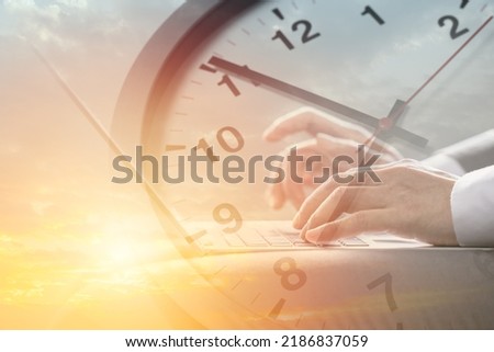 Business working times concept people work typing on laptop computer overlay with in time clock to lunch break Royalty-Free Stock Photo #2186837059