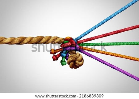 Partners pulling together as a concept for a diverse team partnership and business unity joining to pull for a common goal against a large competitor as a metaphor for diversity and cooperation. Royalty-Free Stock Photo #2186839809