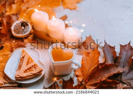 Autumn tea party with cake . Cosiness. Autumn article. Photos for printed products. Autumn. Autumn leaves Royalty-Free Stock Photo #2186844021