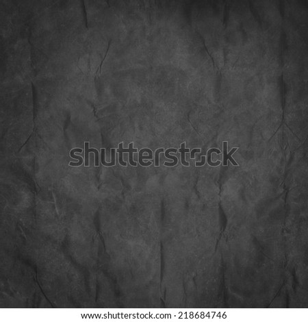 Black background from paper texture with spotlight