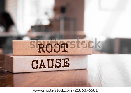 Wooden blocks with words 'Root Cause'. Business concept Royalty-Free Stock Photo #2186876581