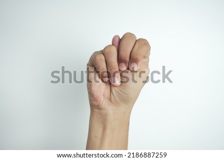 Alphabet - letter N spelling by man's hand in American Sign Language (ASL) on white background