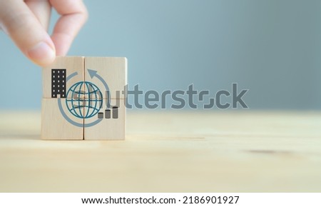 Multinational corporation (MNC), business strategy concept. Standardizing products and services around the world  to gain efficiency. Vertical, horinzontal expansion strategy. New markets, opportunity Royalty-Free Stock Photo #2186901927