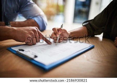 Lawyer, broker or HR manager signing a contract agreement with client or employee. Financial advisor asking for womans signature for insurance, legal paperwork or claim document