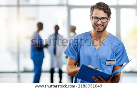 Doctor, medical professional and worker reading from a file, folder or form while working at a hospital. Portrait of a nurse or surgeon checking information, filling in paperwork and holding a Royalty-Free Stock Photo #2186931049