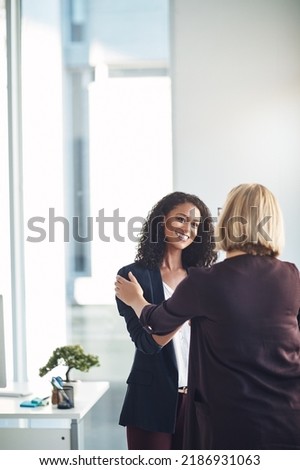 Partnership, teamwork and support with a handshake between two professional business women meeting and greeting in an office. Success discussion with HR about a promotion or positive feedback Royalty-Free Stock Photo #2186931063