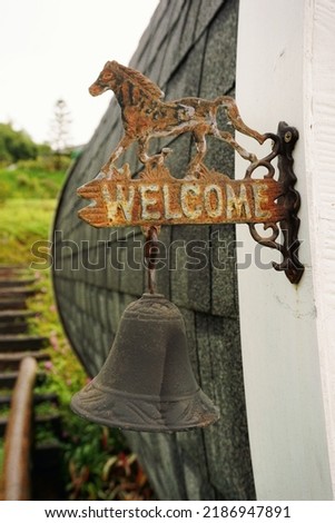 Welcome sign hanging made of iron