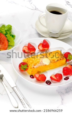 French toast: A fluffy and delicious toast that is soaked in a mixture of eggs and milk and baked.