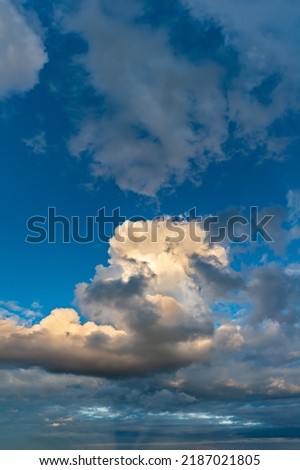 Fantastic soft thunderclouds, natural sky composition, vertical panorama