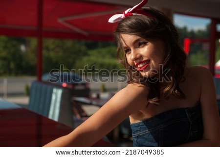 Young girl dressed in pin up style