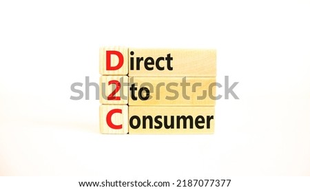 D2C direct to consumer symbol. Concept words D2C direct to consumer on wooden blocks on a beautiful white table white background. Business and D2C direct to consumer concept. Copy space.