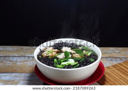Traditional hot soup of fresh seaweed and minced pork serving in the bowl. Famous soft and light menu for easy digestion.  Royalty-Free Stock Photo #2187089263