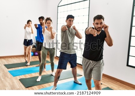 Group of young sporty people concentrate boxing at sport center. Royalty-Free Stock Photo #2187124909