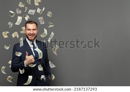 Business, money, finance, people and banking concept. Happy businessman with dollar cash money on grey