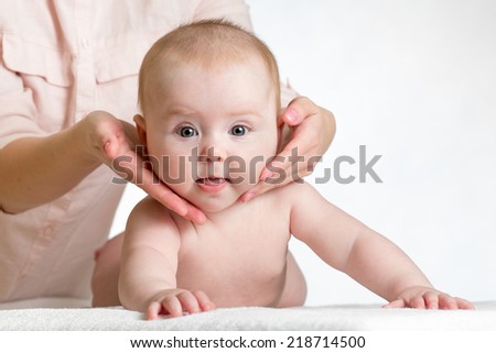 masseur massaging baby girl
