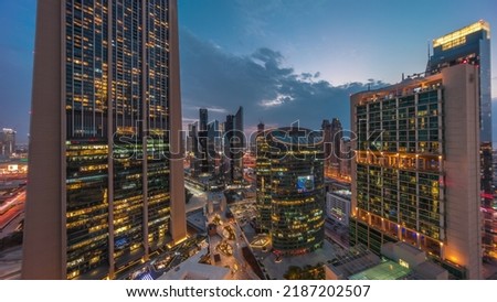 Dubai international financial center skyscrapers aerial day to night transition timelapse. Illuminated towers with promenade panoramic view from above after sunset Royalty-Free Stock Photo #2187202507