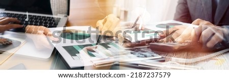 Businessman and team analyzing financial statement Finance task. with smart phone and laptop and tablet. Wealth management concept Royalty-Free Stock Photo #2187237579