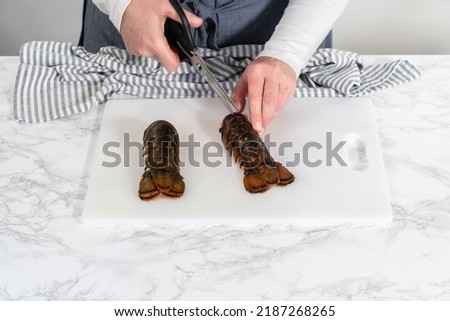 Flat lay. Preparing raw lobster tails to make garlic lobster tails. Royalty-Free Stock Photo #2187268265