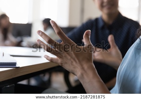 African woman, project leader gesticulate while talk at group meeting in coworking, close up cropped shot. Concept of communication, negotiations, mentoring, client and sales manager meet in office Royalty-Free Stock Photo #2187281875