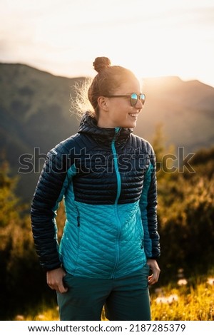 Traveler hiking with backpacks. Hiking in mountains. Sunny landscape. Tourist traveler on background view mockup. High tatras , slovakia