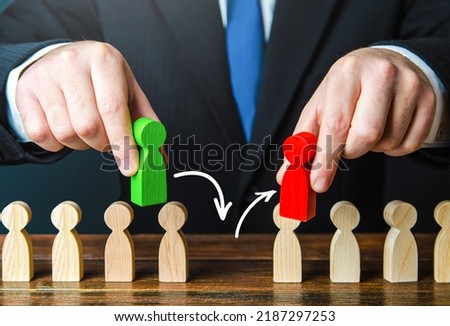 Replacing an old employee with a new one. Replace an incompetent worker. Business management and human resources. Performance improvement. Social toxicity. Nepotism. Personnel changes. Royalty-Free Stock Photo #2187297253