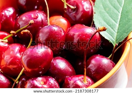 Ripe red cherries in a bowl