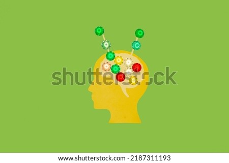 yellow paper head with brain sharing information with outside world, creative art idea on green background