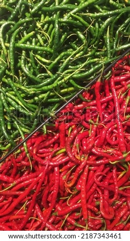 Red and green chilies separated in supermarket vegetable rack