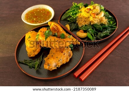 Fish cutlets battered and fried with herbs and spices and spicy, sweet and sour sauce - famous Thai dishes