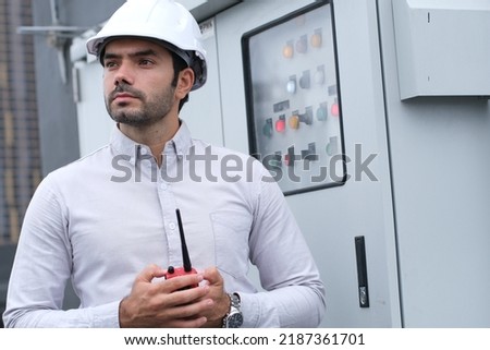 Constructuon electrician engineer caucasian man working with laptop in concept of good management electrical system for construction, logistic, import export transportation business in workplace area.