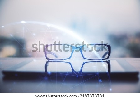 Social network theme drawing with glasses on the table background. Concept of people media connection. Double exposure.