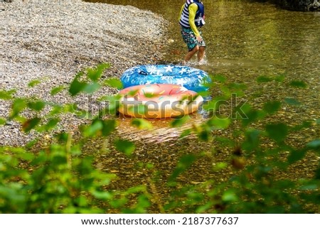 Playing in the river in the summer sun
