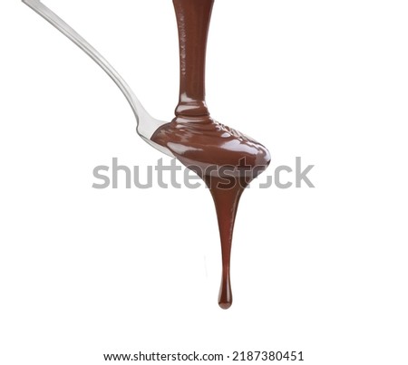 dripping chocolate in a spoon on a white background Royalty-Free Stock Photo #2187380451
