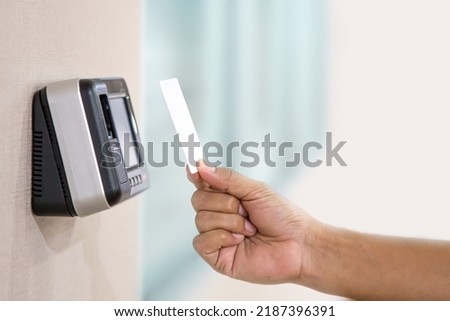 Proximity card reader door unlock, Hand security man using ID card on fingerprint scanning access control system for identity verification to open the door or for security safety or check attendance. Royalty-Free Stock Photo #2187396391