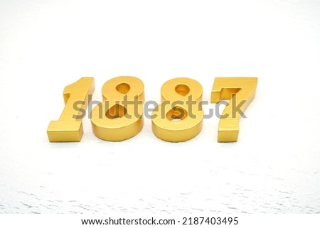      Number 1887 is made of gold painted teak, 1 cm thick, laid on a white painted aerated brick floor, visualized in 3D.                                     