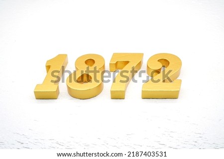      Number 1872 is made of gold painted teak, 1 cm thick, laid on a white painted aerated brick floor, visualized in 3D.                                  
