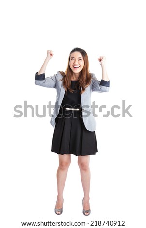Successful young business xwoman happy for her success. Isolated full body image on white background. Mixed Asian / Caucasian businesswoman.