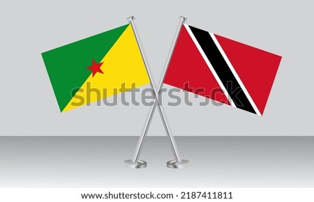 Crossed flags of French Guiana and Trinidad and Tobago. Official colors. Correct proportion. Banner design