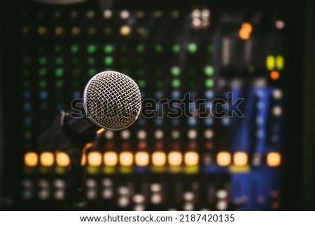 Close up microphone and blur sound mixer background for studio editor record and broadcasting producer live the media concepts.