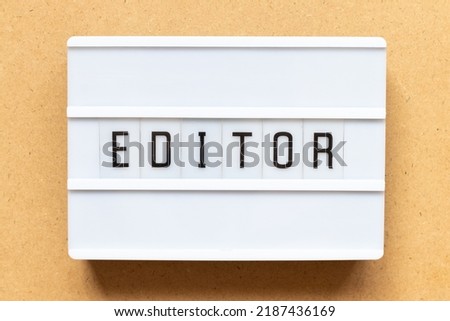 Lightbox with word editor on wood background