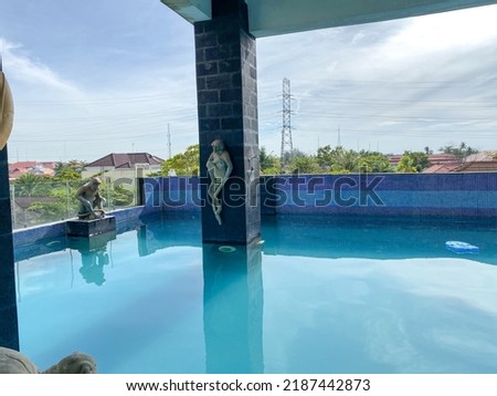 Swimming pool located at G'Sign hotel in banjarmasin