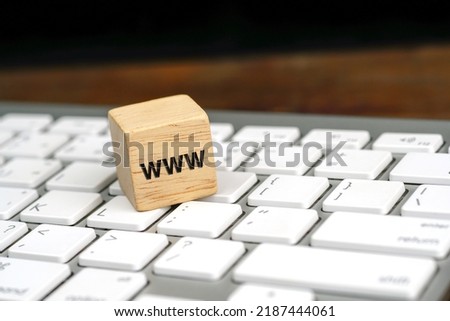 word www, world wide web written on wooden block on white computer keyboard. Online communication or web browsing concept.                    