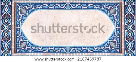 Detail of traditional persian mosaic wall with geometrical and floral ornament, Iran. Horizontal frame with ceramic tile of blue, cian, brown and white colors. Mock up template. Copy space for text Royalty-Free Stock Photo #2187459787