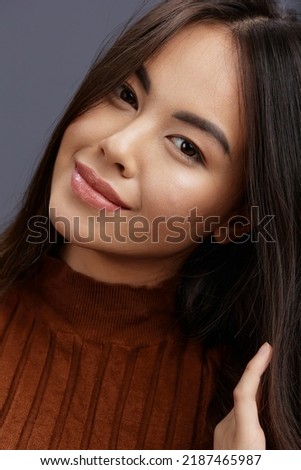 beautiful woman fun brown sweater posing casual wear Gray background