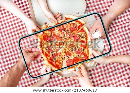 Food photo, food photography concept with hands taking pizza in cellphone viewfinder.